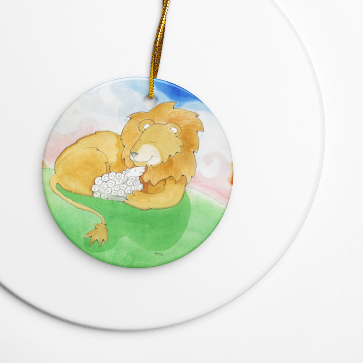 Lion and Lamb ceramic ornament resting on a white plate