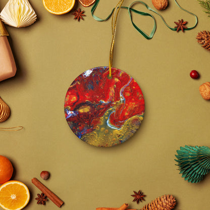 Lava Flow ceramic ornament on a gold string among holiday oranges and pinecones
