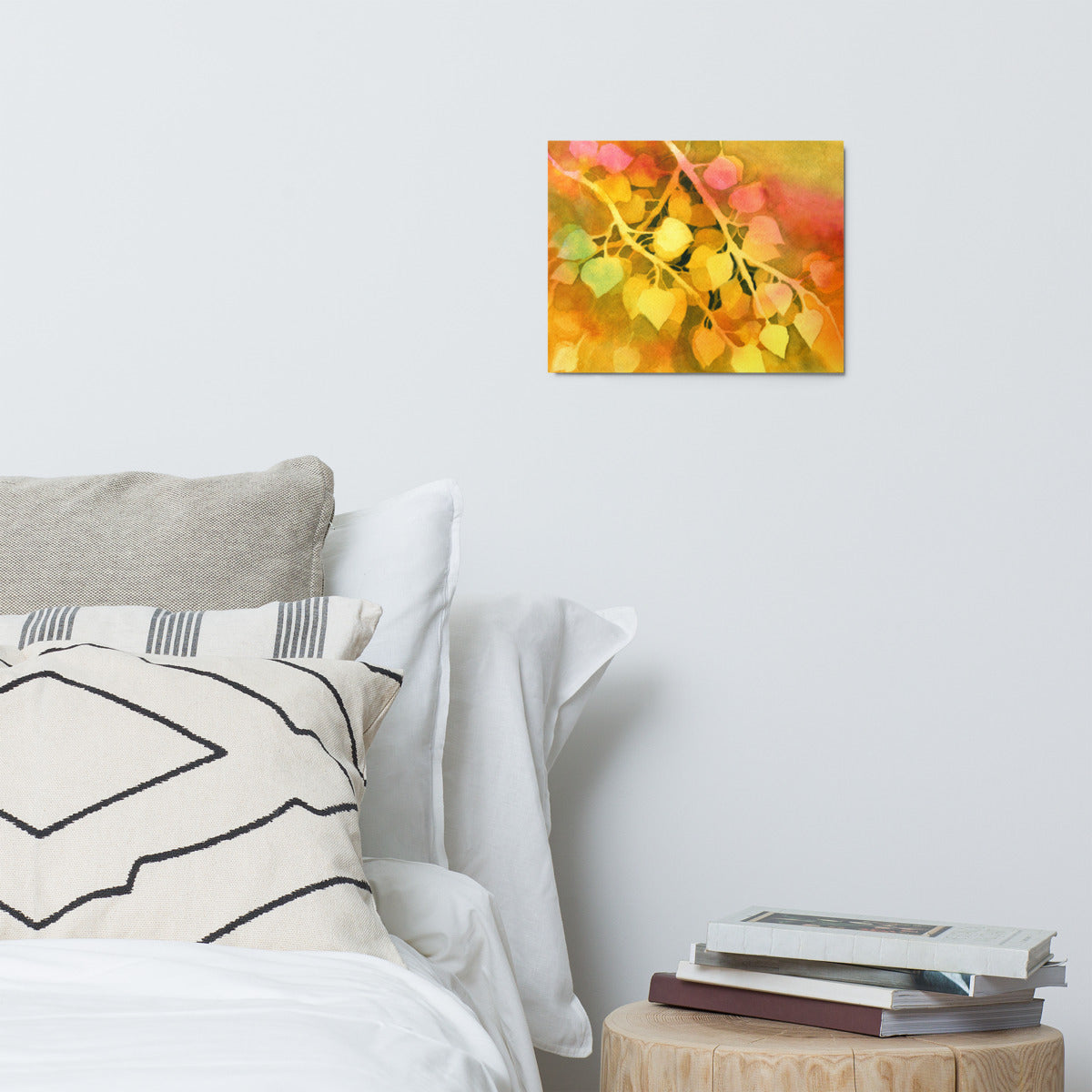 Golden Aspen metal print hanging above a bed with white pillows