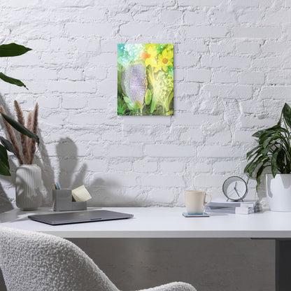 Grief and Forgiveness Garden metal print on a white brick wall above a desk