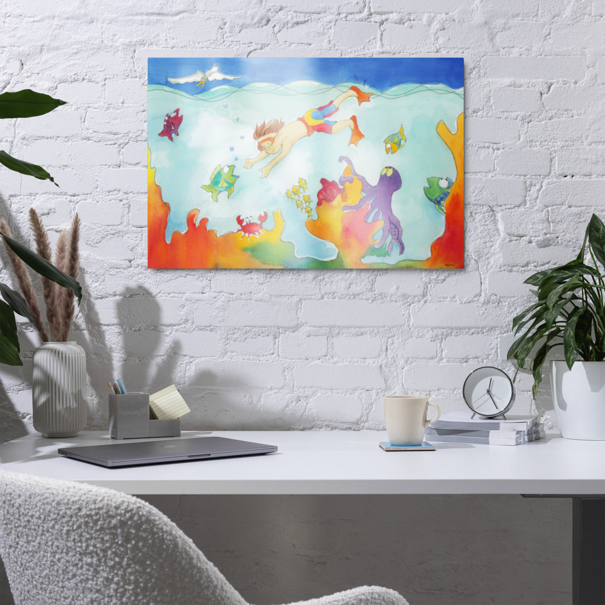 Diver metal print on a white brick wall above a desk