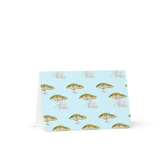Elephant and Trees Pattern greeting card front in blue with grey elephants under acacia trees