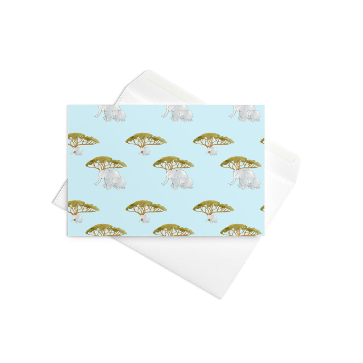 Elephant and Trees greeting card on top of its white envelope