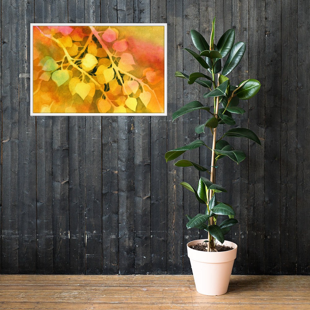 Framed golden aspen leaf print on a dark wood wall beside a potted fig tree